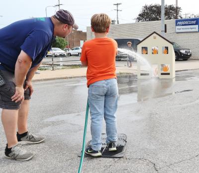 Water Game with Volunteer and Child